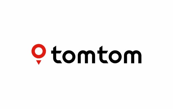 v-The TomTom logo displayed prominently, representing the kickoff event in Haarlem, Netherlands, where Carlos Moreno will discuss the 15-minute city concept during a panel and exclusive interview.